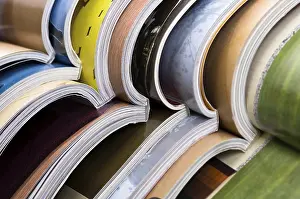 Interior Space Design Imprime: Stack of open magazines