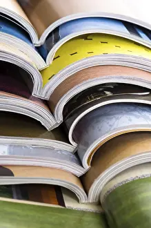 Waste Management Practices Imprime: Stack of open magazines