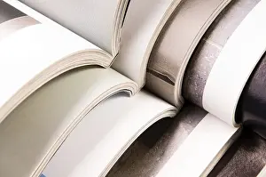 Waste Separation Techniques Imprime: Stack of open magazines