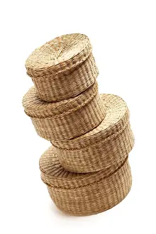 White Studio Backdrop Imprime: Stack of various sized wicker baskets isolated on white