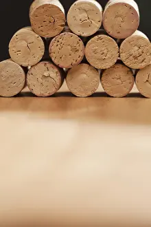 Uninhabited Winery Scene Imprime: Stack of wine corks on a wood surface