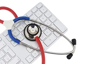 Symbolic Healthcare Image Imprime: Stethoscope and keyboard of a computer