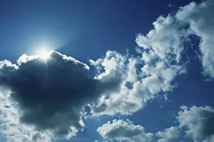 Cloud Formations In The Sky Imprime: Sun behind clouds