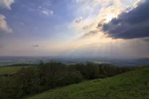Thunderstorm In Europe Imprime: Sunbeams behind thunderclouds, mountain top