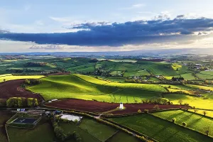 Evening Light In England Imprime: Sunset of Devon Windmill over Fields and Farms from a drone
