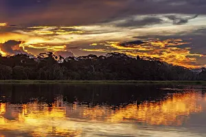Dramatic Sky Reflections Imprime: Sunset over a river with dramatic sky and intense reflections