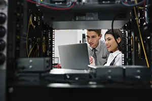 Healthcare Technology Imprime: Team of technicians working together on servers at the data centre