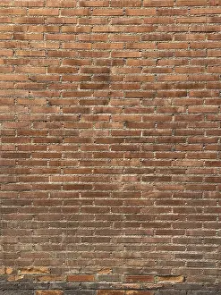 Red Brick Wall Imprime: A textured red brick wall with a consistent horizontal pattern