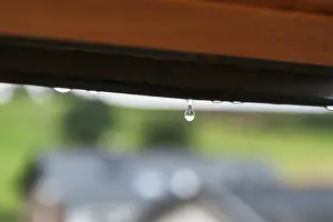 Central Europe Weather Imprime: Tiny raindrop hangs on window frame
