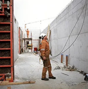 Protective Clothing Imprime: Unfinished constructions construction work - setting up a wall