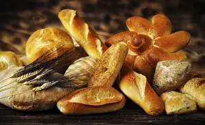 Rustic Bread Imprime: Various types of bread in a rustic setting with warm light
