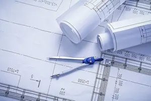 Construction Plan Blueprint Imprime: Vertical version compass and rolled blueprints close up