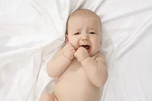 Caucasian Child Portrait Imprime: Top view of child crying while looking at camera