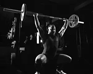 Fitness Studio Exercise Imprime: Weightlifter does an exercise with a barbell
