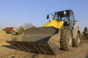 Construction Site Germany Imprime: Wheel loader at sunset, here in the RingstraBe development area (Mutterstadt)