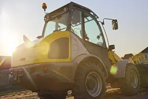 Construction Site Germany Imprime: Wheel loader at sunset, here in the RingstraBe development area (Mutterstadt)