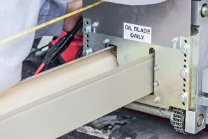 Rain Gutter Installation Imprime: Worker Measuring Rain Gutter Processing Through Seamless Shaping Machine