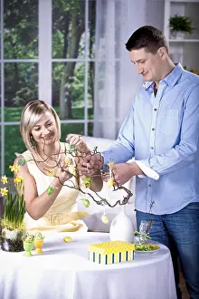 Easter Decorations Imprime: Young couple decorating for Easter